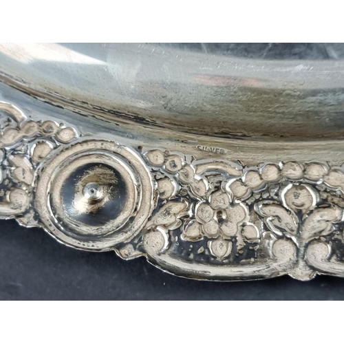 237 - A white metal tray, having faceted glass jewels to rim, stamped 'silver', 35cm diameter.... 