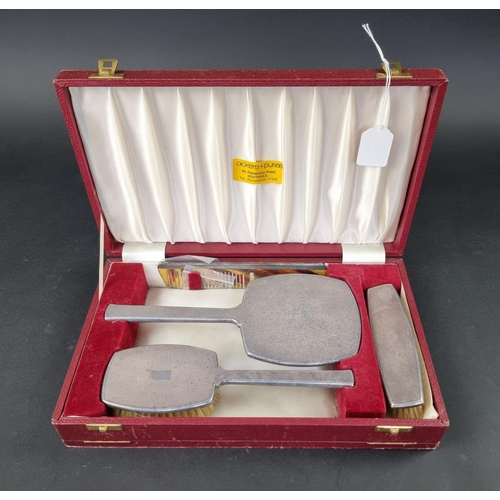 263 - A cased engine turned four piece dressing table set, by Deakin & Francis Ltd, Birmingham 1967-70... 