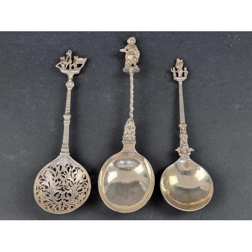 275 - Three 19th century Dutch white metal spoons, having decorated terminals.