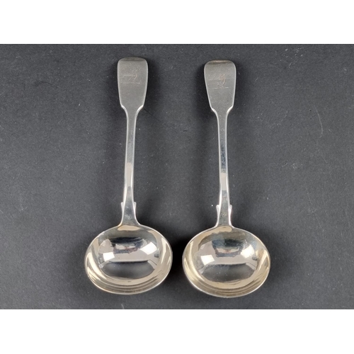 284 - A pair of Victorian silver fiddle pattern sauce ladles, by W S, London 1840, 149g.