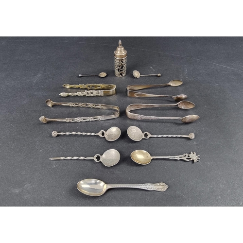 287 - Four pairs of silver tongs; together with a silver mounted pepperette; and seven silver and white me... 