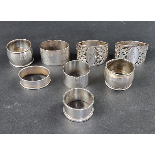 294 - Eight various silver napkin rings, 185g.