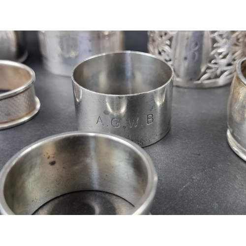 294 - Eight various silver napkin rings, 185g.