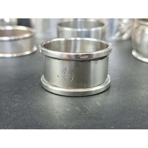 294 - Eight various silver napkin rings, 185g.