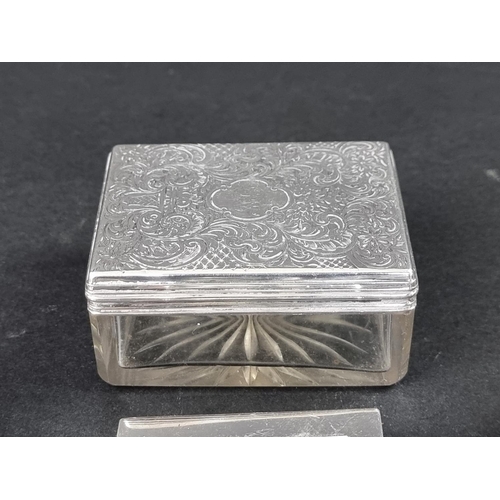 297 - An Edwardian silver lidded box, by L S, Birmingham 1909, 3.5cm high, 6.5cm diameter; together with a... 