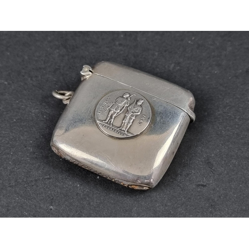 311 - A silver vesta case, decorated the emblem of the National Rifle Association (GB), by Charles S Green... 