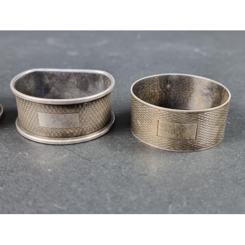 322 - A pair of silver napkin rings, by Henry Griffith & Sons Ltd, Birmingham 1948/9; together with tw... 