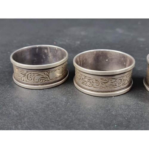 322 - A pair of silver napkin rings, by Henry Griffith & Sons Ltd, Birmingham 1948/9; together with tw... 