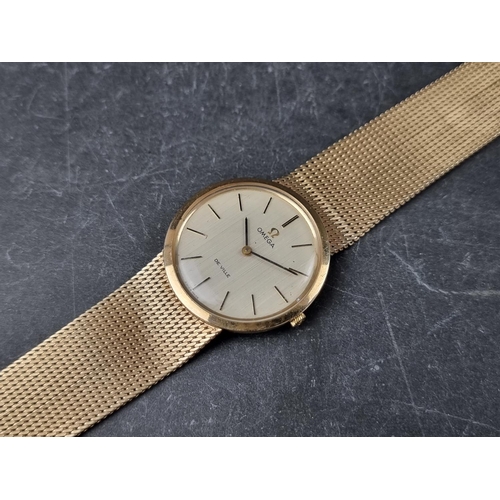 641 - A vintage Omega 'De Ville' 9ct gold manual wind wristwatch, 33mm, on 9ct gold Omega Milanese bracele... 