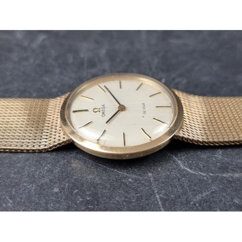 641 - A vintage Omega 'De Ville' 9ct gold manual wind wristwatch, 33mm, on 9ct gold Omega Milanese bracele... 