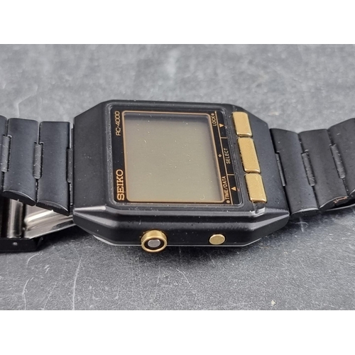 673 - A 1980s Seiko 'RC-4000 PC Datagraph' black stainless steel digital wristwatch, 34mm, Ref. S521-4000,... 