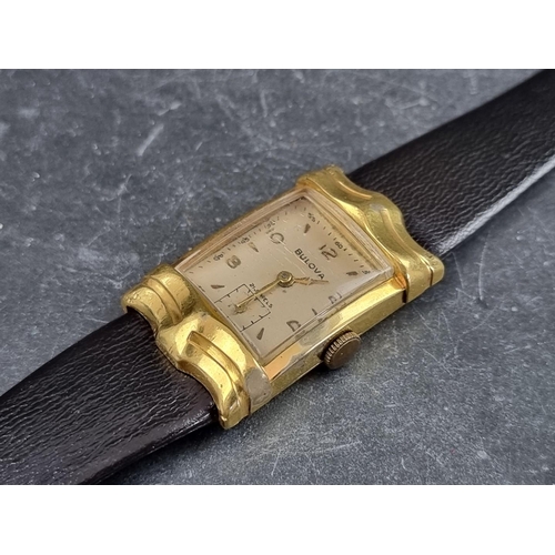 697 - A 1950s Art Deco style Bulova gold plated manual wind wristwatch, 22 x 37mm, on vintage black leathe... 