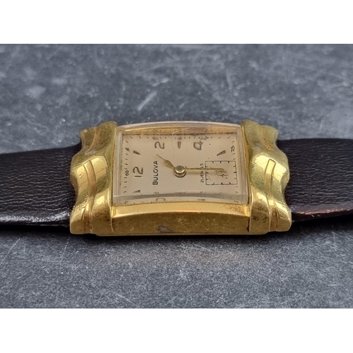 697 - A 1950s Art Deco style Bulova gold plated manual wind wristwatch, 22 x 37mm, on vintage black leathe... 