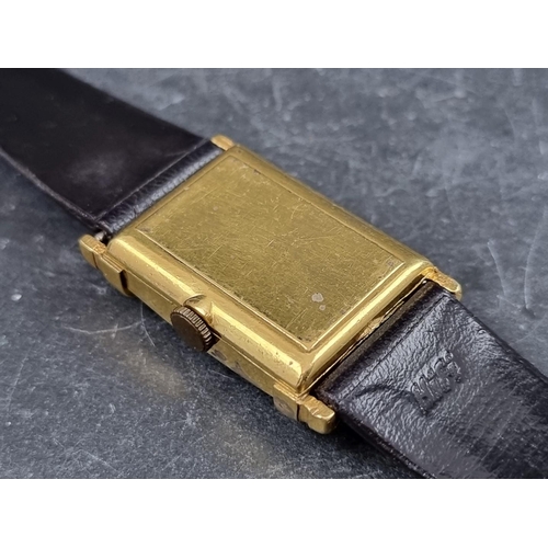 697 - A 1950s Art Deco style Bulova gold plated manual wind wristwatch, 22 x 37mm, on vintage black leathe... 