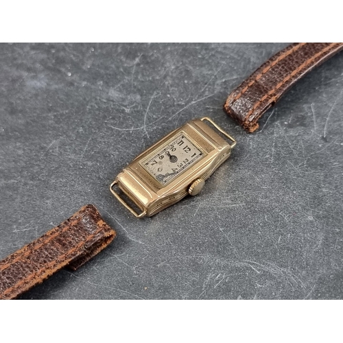 710 - A circa 1930s 9ct gold manual wind ladies wristwatch, 14mm, with brown leather strap.... 