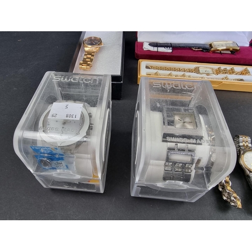 738D - A large quantity of wristwatches, to include two boxed Swatch examples.