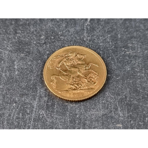 744 - Coins: a George V 1913 gold sovereign.