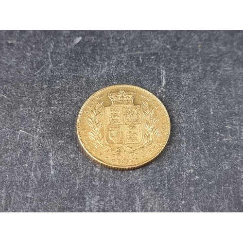 745 - Coins: a Victoria 1842 gold sovereign, young head shield back.