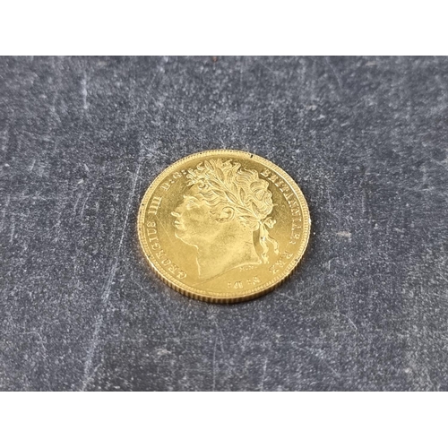 752 - Coins: a rare George IIII 1821 gold sovereign, in near uncirculated condition.