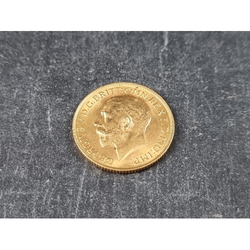 754 - Coins: a George V 1913 gold sovereign.