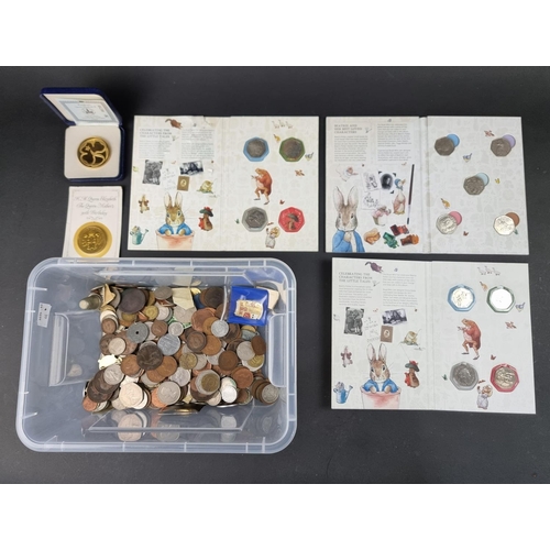 795 - Coins: a quantity of UK and world coins; to include twelve Beatrix Potter fifty pence coins and a vi... 