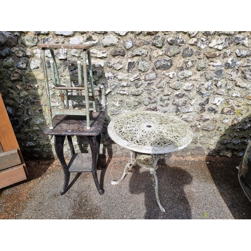 1133 - A white painted aluminium garden table, 68.5cm diameter; together with a carved wood table; and an o... 