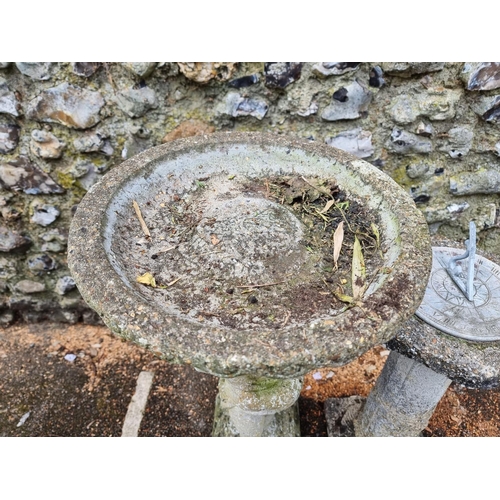 1641 - A composition stone figural bird bath, 87cm high; together with a pedestal sun dial. (2) ... 