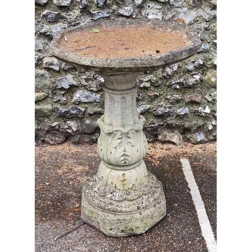 1650 - A large composition stone octagonal pedestal bird bath, 57.5cm wide.