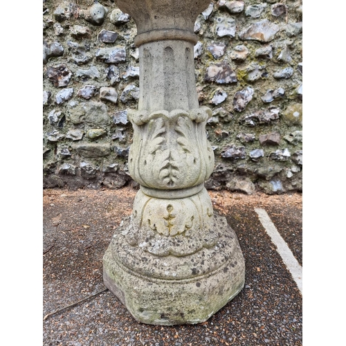 1650 - A large composition stone octagonal pedestal bird bath, 57.5cm wide.