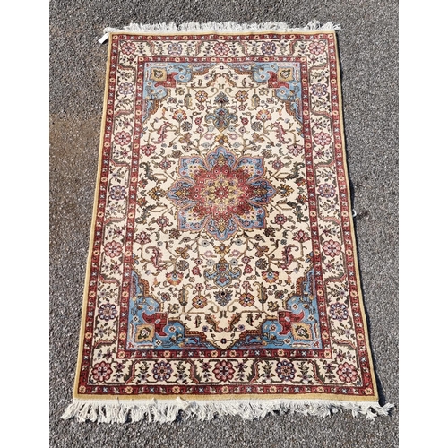 1656 - A Persian rug, having central flower medallion, with floral cartouches to each corner, with floral b... 