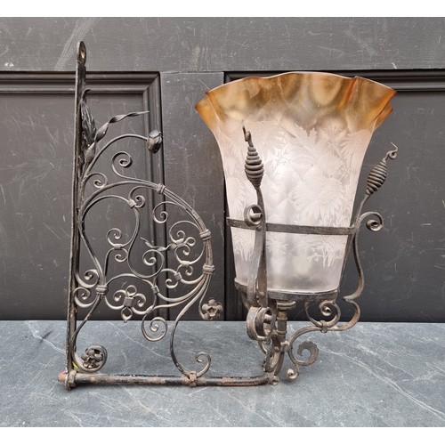 1628A - A wrought iron or steel wall light bracket, with etched glass shade, 43cm high x 40cm deep.... 