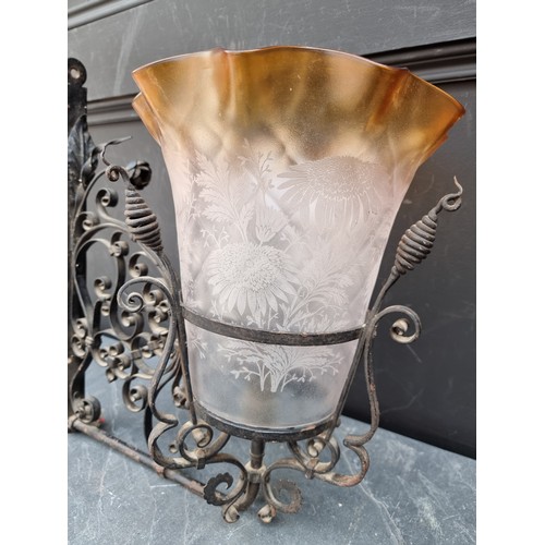 1628A - A wrought iron or steel wall light bracket, with etched glass shade, 43cm high x 40cm deep.... 