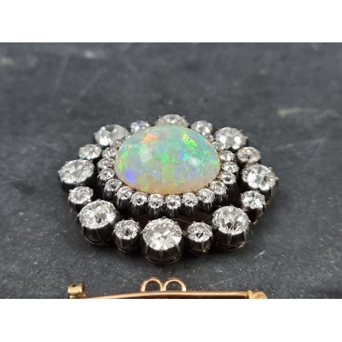 447 - An impressive Victorian opal and diamond brooch, set central cabochon opal, estimated at 8.5ct, surr... 