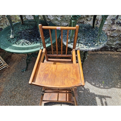 1134 - A vintage beech and plywood child's highchair.