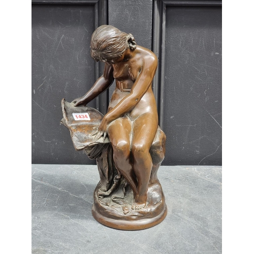 1434 - A bronzed resin seated nude, 36cm high.