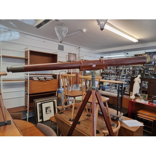 1580 - A large mahogany and brass mounted telescope, 170cm extended, on large conforming tripod.... 