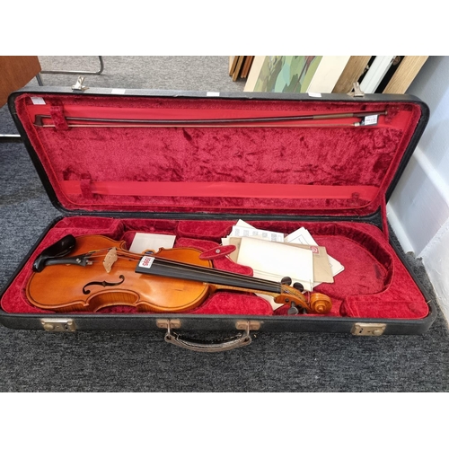 1595 - A violin, labelled 'Frederick G Stanton, London 1962', with 14in two-piece back, with bow, in fitted... 