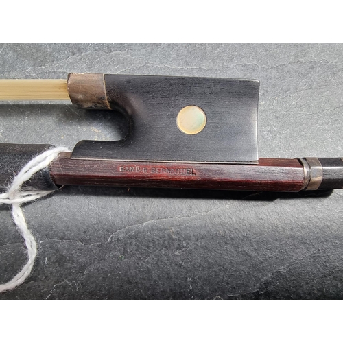 1596 - A white metal mounted violin bow, inscribed 'Gand & Bernardel', 74.3cm long.