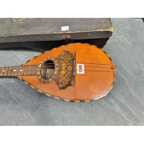 1599 - An Italian eight string mandolin, labelled 'Gennaro Maglioni, Napoli', in case. ... 