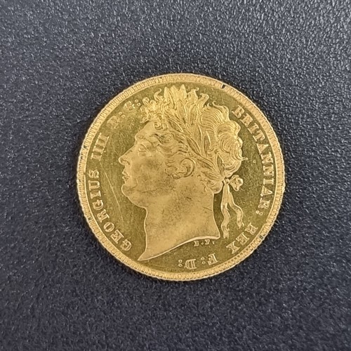 752 - Coins: a rare George IIII 1821 gold sovereign, in near uncirculated condition.