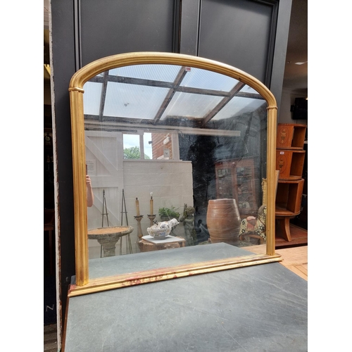 1118 - A large reproduction gilt framed overmantel mirror, 119.5 x 124.5cm.