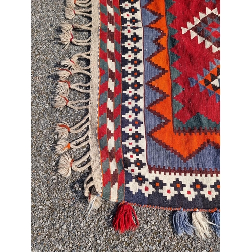 1134 - A Tribal Aztec rug, having allover geometric design, 270 x 158cm.