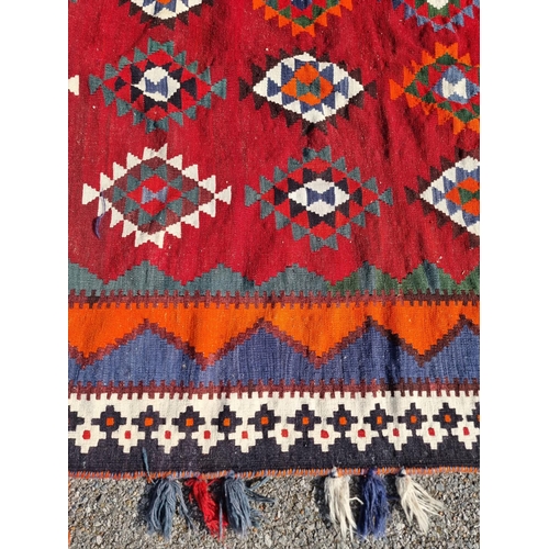 1134 - A Tribal Aztec rug, having allover geometric design, 270 x 158cm.