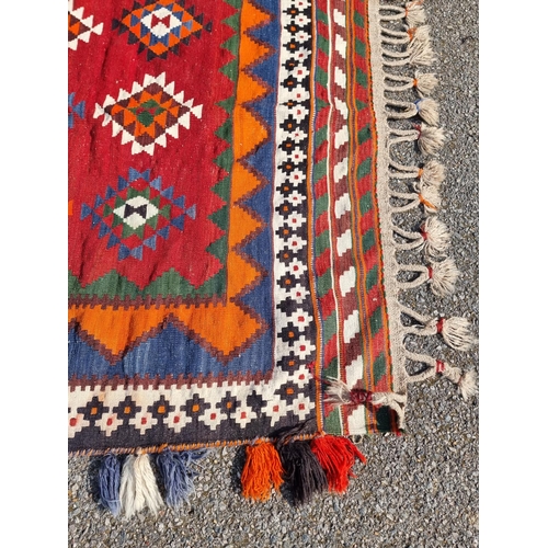 1134 - A Tribal Aztec rug, having allover geometric design, 270 x 158cm.