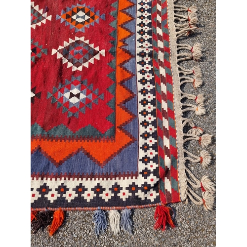 1134 - A Tribal Aztec rug, having allover geometric design, 270 x 158cm.