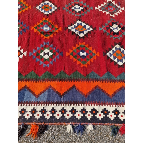 1134 - A Tribal Aztec rug, having allover geometric design, 270 x 158cm.