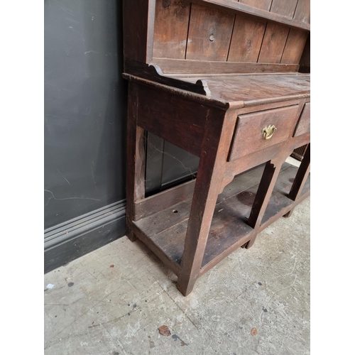 1000 - An 18th century oak 'Dog Kennel' dresser and rack, 152.5cm wide.