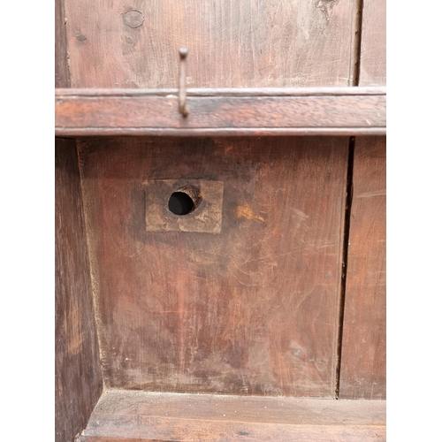 1000 - An 18th century oak 'Dog Kennel' dresser and rack, 152.5cm wide.