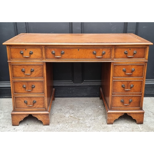 1003 - A reproduction mahogany pedestal desk, 121.5cm wide.