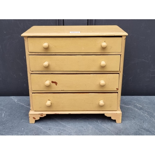 1011 - An old miniature painted pine chest of drawers, 31.5cm high x 32cm wide.